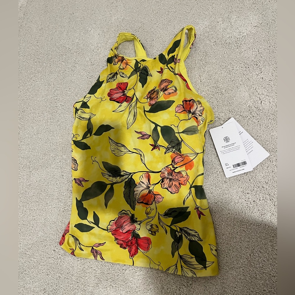 New with tags, built in bra, beautiful yellow floral Athleta tank